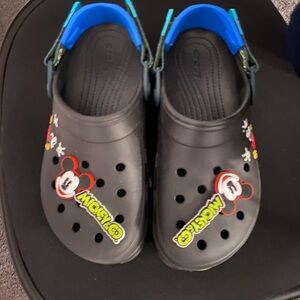 Crocs.  Bought at Disneyland and wore once.  Like New!